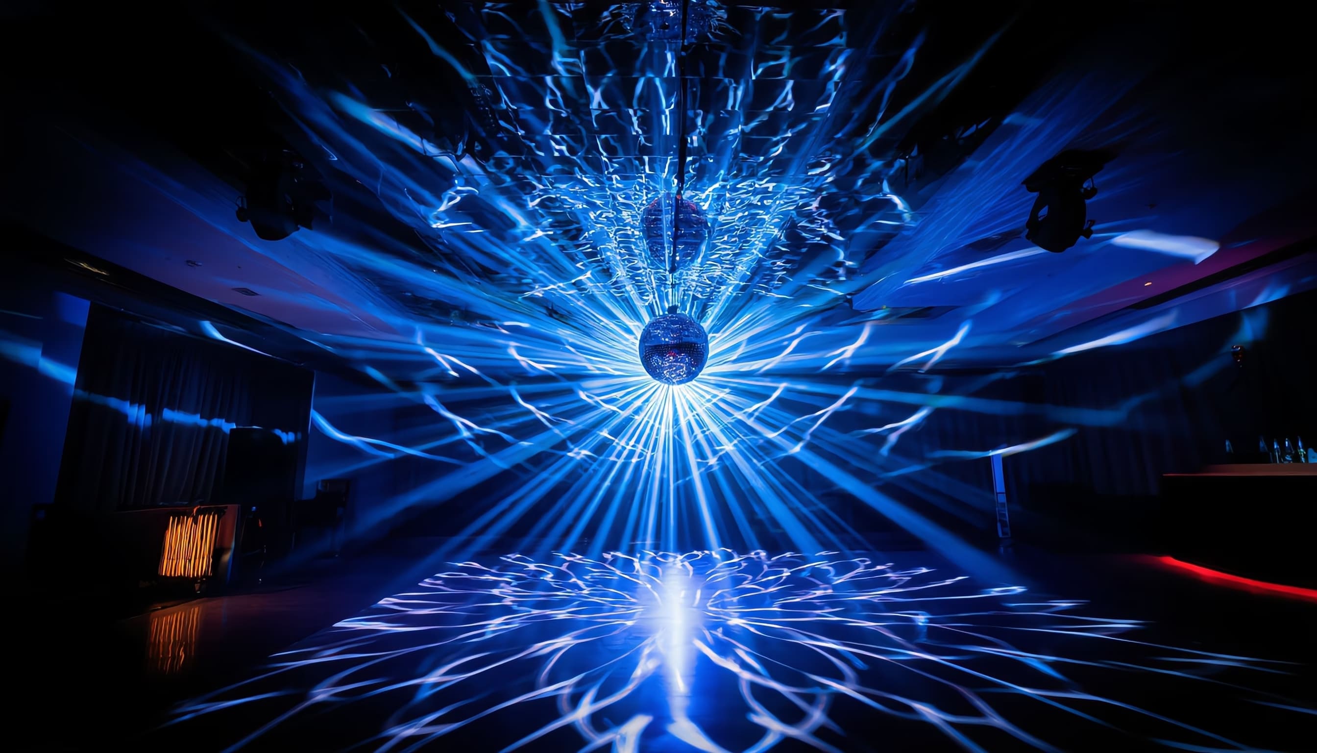 Dimensional light explosion effect with refracted patterns across NYC dance floor